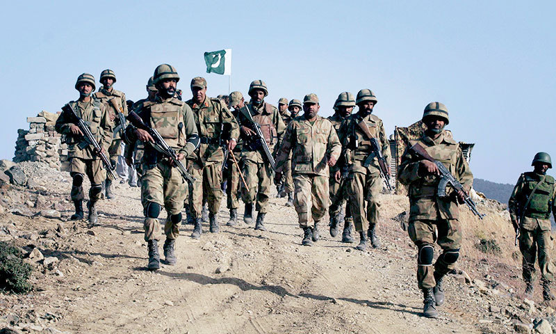 Pakistan Army soldiers patrolling near the Pakistan–Afghanistan border amid rising military tensions and conflict.